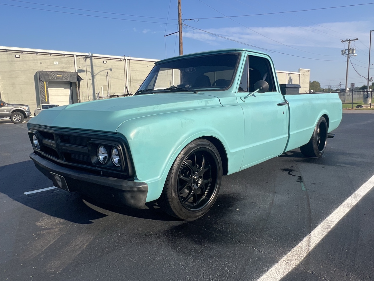 Current turquoise 1967 GMC Comeback Build with black grille and black wheels