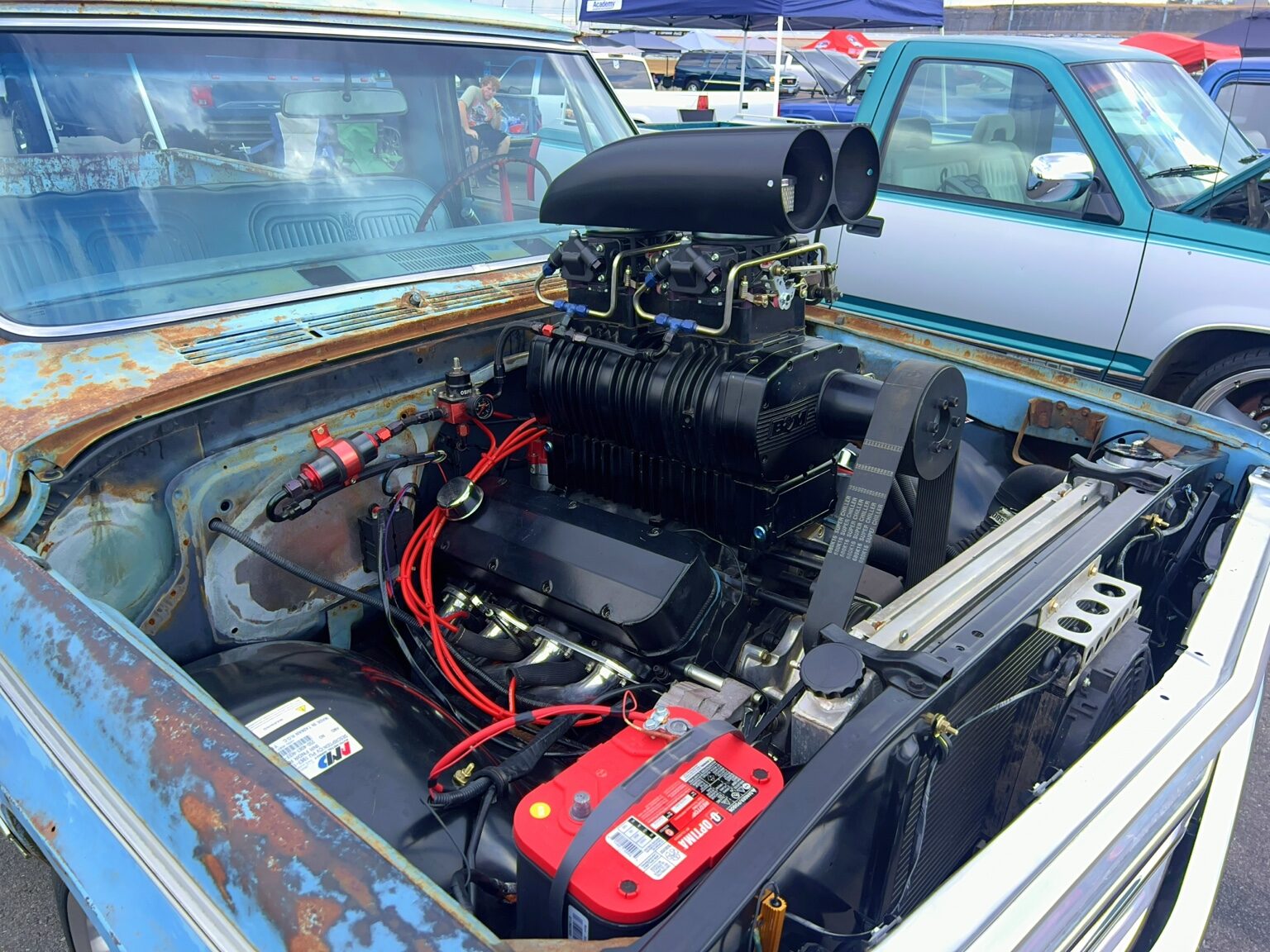 Supercharged engine detail in a patina Chevrolet C10