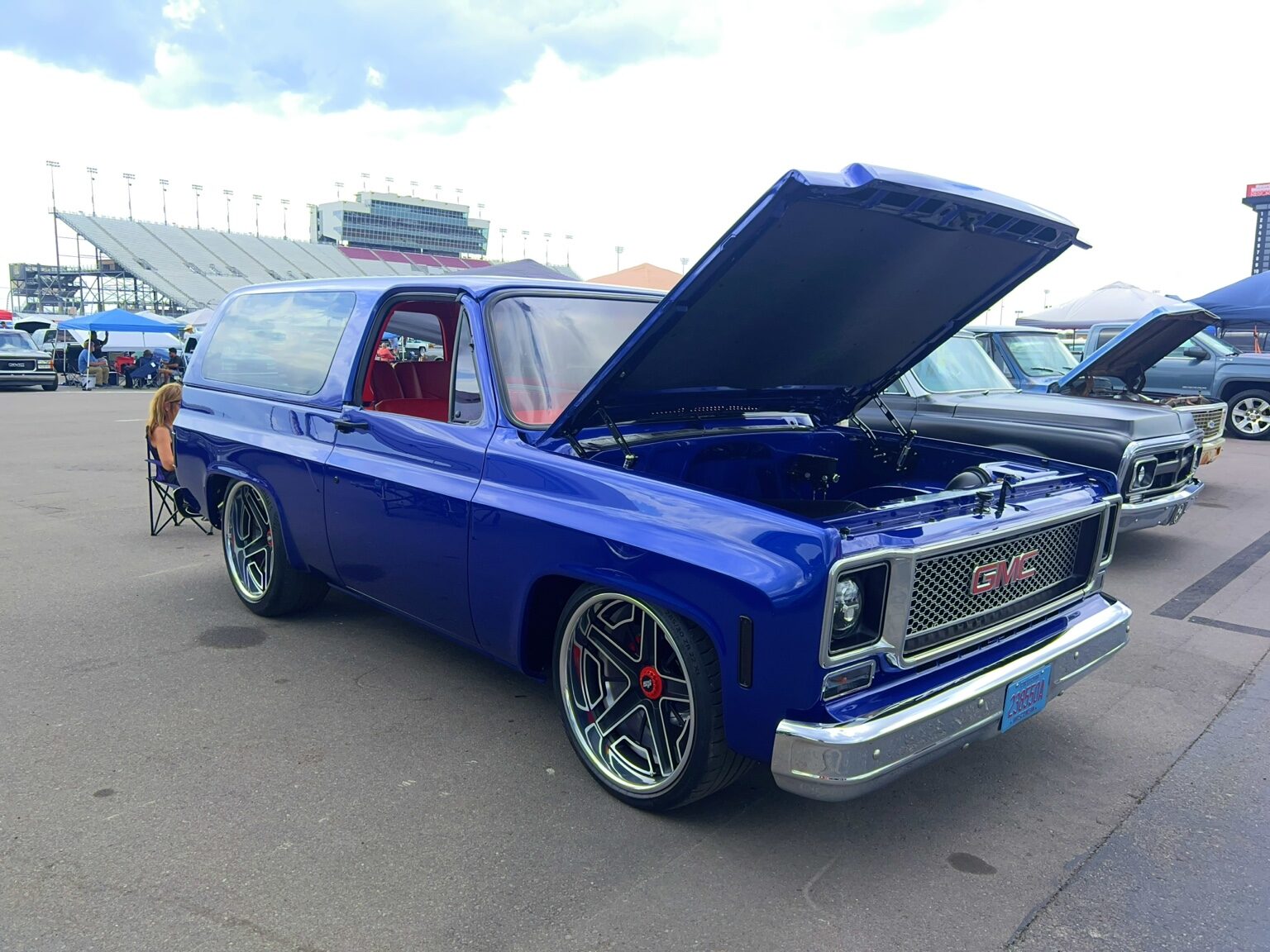 Blue custom Chevrolet panel truck with its hood open