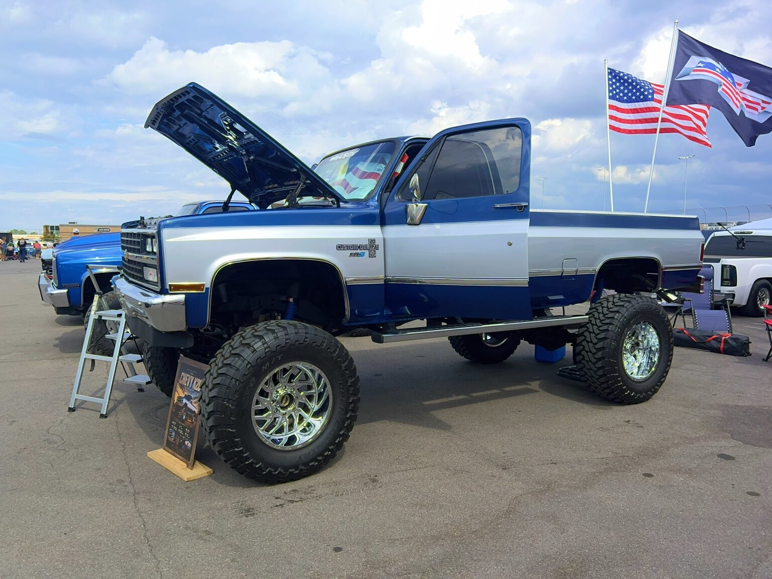 Lifted blue and white Chevrolet truck at C10 Nationals Nashville 2026