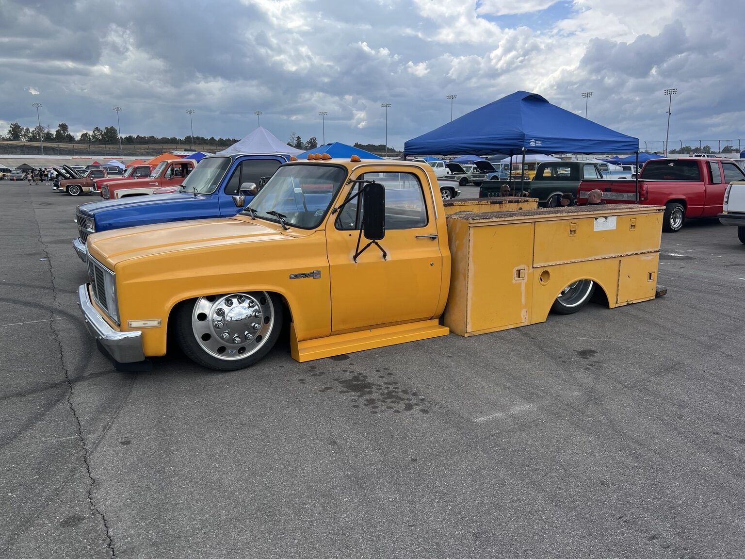 Yellow lowered Chevrolet square-body service-bed truck
