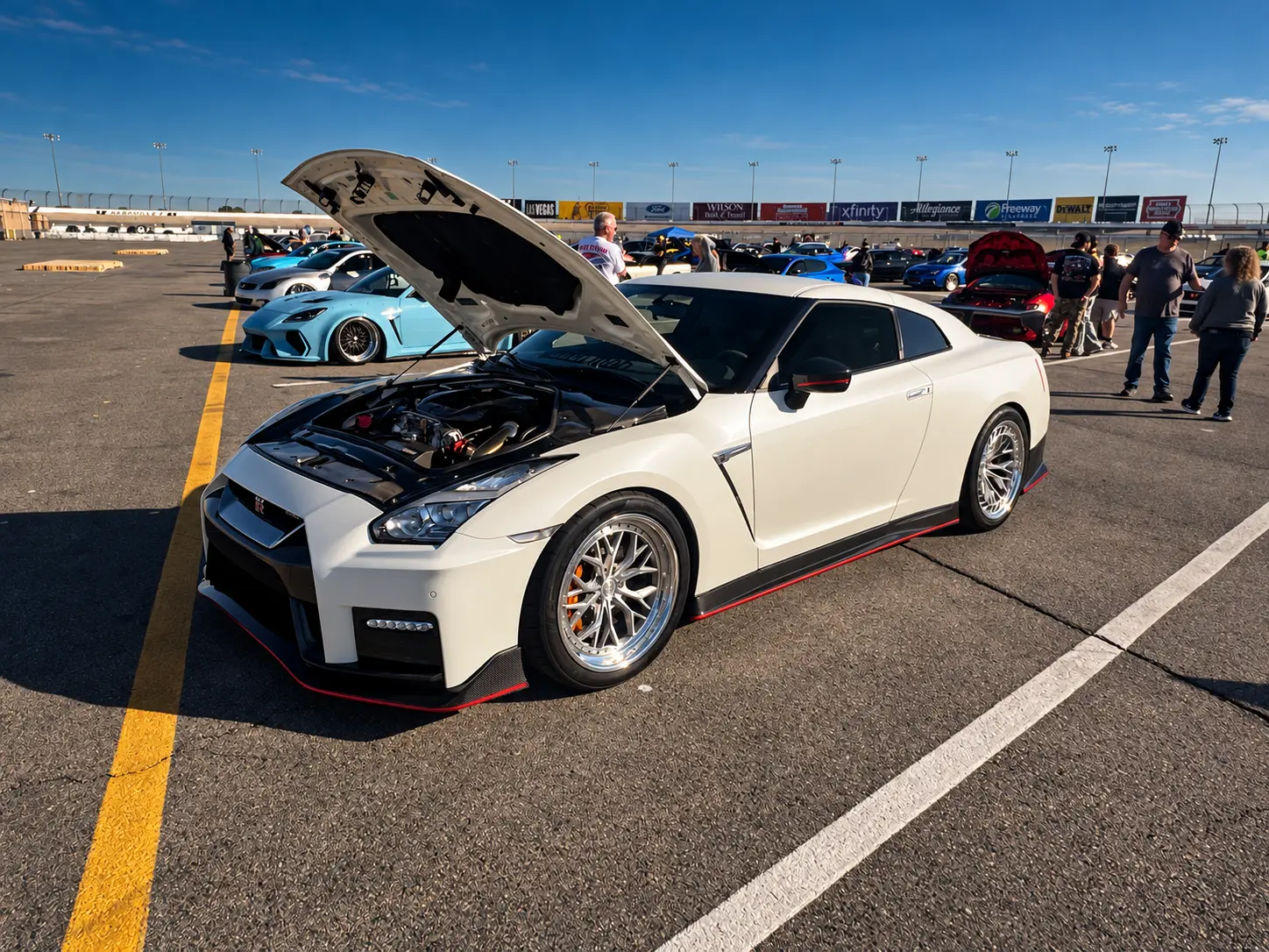 White Nissan GT-R with its hood open at ImportAlliance Nashville Fall 2026