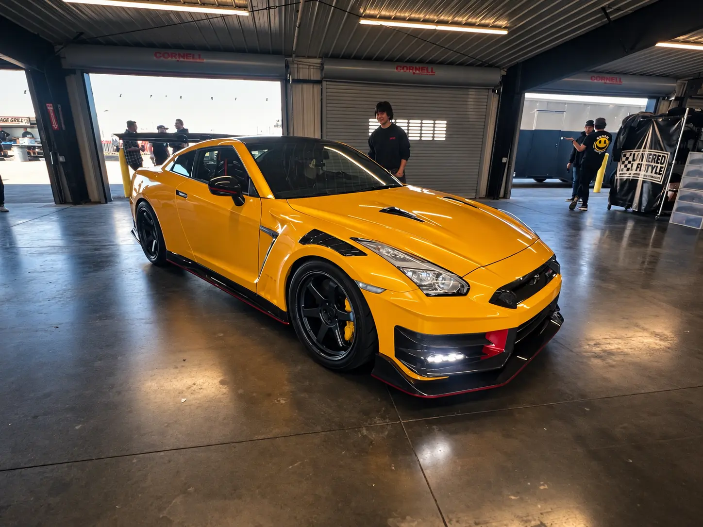 Yellow Nissan GT-R on display indoors at ImportAlliance Nashville Fall 2026